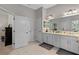Bright main bathroom with double sinks, granite countertops, and bright white cabinetry at 6011 Caldera Ridge Dr, Lithia, FL 33547