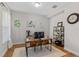 Bright and spacious home office with a large desk, natural light, and ample storage space at 6011 Caldera Ridge Dr, Lithia, FL 33547