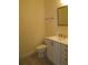 Neutral bathroom with a vanity, faucet, mirror, toilet, and tile flooring at 603 5Th S St, Safety Harbor, FL 34695