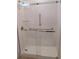 Modern shower with glass door and white tiled walls at 603 5Th S St, Safety Harbor, FL 34695