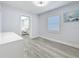 Additional bedroom with stylish gray floors, and natural light at 6609 Dartmouth N Ave, St Petersburg, FL 33710