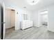 Bright bedroom with lots of storage and gray wood-look floors at 6609 Dartmouth N Ave, St Petersburg, FL 33710