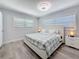 Inviting bedroom with natural light, gray floors, and stylish furnishings at 6609 Dartmouth N Ave, St Petersburg, FL 33710