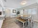 Spacious dining room featuring a wooden dining table and a convenient bench at 6609 Dartmouth N Ave, St Petersburg, FL 33710