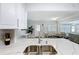 Modern kitchen with stainless steel appliances and an eat-in island at 6609 Dartmouth N Ave, St Petersburg, FL 33710
