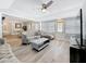 Comfortable living room showcasing stylish decor, hardwood floors, and a ceiling fan at 6609 Dartmouth N Ave, St Petersburg, FL 33710