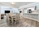 Open floor plan integrating kitchen, dining, and living room areas with modern finishes at 6609 Dartmouth N Ave, St Petersburg, FL 33710
