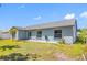 Enjoy an expansive backyard with a concrete patio, offering a serene outdoor experience and potential for gardening at 7080 Nicole Ln, Largo, FL 33771