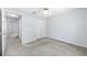 Bedroom with Plush gray carpet, ceiling fan and double door closet at 7080 Nicole Ln, Largo, FL 33771