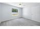 Bright bedroom with ceiling fan and view of the backyard at 7080 Nicole Ln, Largo, FL 33771
