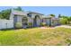 Charming single-story home with a well-maintained lawn and inviting front entrance at 7080 Nicole Ln, Largo, FL 33771
