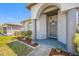 Close up of the front porch with stone pillars and landscaping at 7080 Nicole Ln, Largo, FL 33771