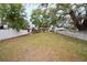Expansive backyard with mature trees, shed, and fencing, perfect for outdoor activities and privacy at 7141 56Th N St, Pinellas Park, FL 33781