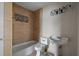 Bathroom featuring a pedestal sink, decorative tile, and a shower at 7141 56Th N St, Pinellas Park, FL 33781
