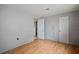 Bedroom with wood floors featuring multiple closets and bright walls at 7141 56Th N St, Pinellas Park, FL 33781