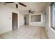 Spacious living room with tile flooring, natural light, and ceiling fans at 7141 56Th N St, Pinellas Park, FL 33781