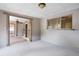 Spacious sunroom with pass through window and ceiling fan, ready for your personal touch at 7141 56Th N St, Pinellas Park, FL 33781