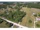 Expansive property showcasing lush greenery and trees, dotted with scattered homes in a serene, rural setting at 7509 Hackamore Rd, Zephyrhills, FL 33541