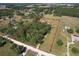 Aerial view of the land parcel shows lush greenery, bordered in red to highlight the property's boundaries at 7509 Hackamore Rd, Zephyrhills, FL 33541