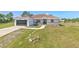 Charming single-story home featuring a well-manicured lawn and an attached two-car garage at 7509 Hackamore Rd, Zephyrhills, FL 33541