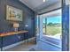 Welcoming foyer with stylish decor, featuring wood-look tile flooring and a view to the outdoors at 7509 Hackamore Rd, Zephyrhills, FL 33541