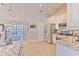 Kitchen featuring an island, stainless steel appliances, and modern lighting at 7509 Hackamore Rd, Zephyrhills, FL 33541