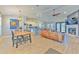 Bright, open-concept living area that seamlessly blends the kitchen, dining, and living spaces at 7509 Hackamore Rd, Zephyrhills, FL 33541