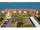 Stunning aerial view of the condominium complex nestled along the serene waterfront with manicured lawns at 7520 Sunshine Skyway S Ln # 110, St Petersburg, FL 33711