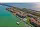 Picturesque aerial view of waterfront condos, pool, lush greenery, and access to stunning bay at 7520 Sunshine Skyway S Ln # 110, St Petersburg, FL 33711