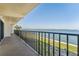 Enjoy breathtaking water views from this balcony with black metal railings and tile floors at 7520 Sunshine Skyway S Ln # 110, St Petersburg, FL 33711