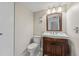 Comfortable bathroom with classic vanity, toilet, and doorway for privacy at 7520 Sunshine Skyway S Ln # 110, St Petersburg, FL 33711