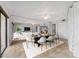 Open-concept dining and living space with modern table, neutral decor, and water views at 7520 Sunshine Skyway S Ln # 110, St Petersburg, FL 33711