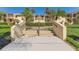 Entrance stairway leading to an inviting building exterior with beautiful landscaping at 7520 Sunshine Skyway S Ln # 110, St Petersburg, FL 33711