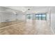 Spacious living area with tile flooring, floor to ceiling mirrors, and beautiful water views at 7520 Sunshine Skyway S Ln # 110, St Petersburg, FL 33711