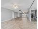Large, open living space with neutral paint, ceiling fans, and lots of room to furnish at 7520 Sunshine Skyway S Ln # 110, St Petersburg, FL 33711