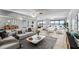 Modern living room with neutral tones, stylish furnishings and expansive water views at 7520 Sunshine Skyway S Ln # 110, St Petersburg, FL 33711
