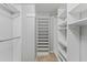 Spacious walk-in closet featuring built-in shelving and ample storage for clothing and accessories at 7520 Sunshine Skyway S Ln # 110, St Petersburg, FL 33711