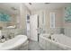 Bright bathroom with a large soaking tub and glass block window accents at 8614 Hibiscus Dr, Tampa, FL 33637
