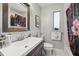 Bright bathroom with a large mirror, stylish sink, and unique shower curtain at 8614 Hibiscus Dr, Tampa, FL 33637