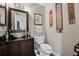 The bathroom features a glass bowl sink, a dark wood vanity, and colorful wall decor at 8614 Hibiscus Dr, Tampa, FL 33637