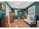 The bedroom features unique wall art, hardwood floors, and plentiful natural light at 8614 Hibiscus Dr, Tampa, FL 33637