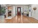 Foyer with hardwood floors and a sauna, accented by natural light from the front door windows at 8614 Hibiscus Dr, Tampa, FL 33637