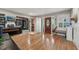 Open foyer with hardwood floors, a wood front door, and a sauna, creating a welcoming entrance at 8614 Hibiscus Dr, Tampa, FL 33637