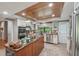 Well-equipped kitchen with granite countertops, stainless steel appliances and a central island cooktop at 8614 Hibiscus Dr, Tampa, FL 33637