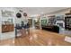 Spacious living room with hardwood floors, fireplace, and a view of the outdoors at 8614 Hibiscus Dr, Tampa, FL 33637