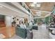Inviting living room with high wood ceilings, skylights, and a comfortable green sectional sofa at 8614 Hibiscus Dr, Tampa, FL 33637