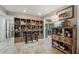 Open living room with tile floors, natural light, and a view of the outdoor scenery at 8614 Hibiscus Dr, Tampa, FL 33637