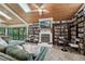Spacious living room with a fireplace, wood ceilings, and lots of natural light at 8614 Hibiscus Dr, Tampa, FL 33637