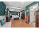 Bright bedroom with hardwood floors and a view of the ensuite bathroom at 8614 Hibiscus Dr, Tampa, FL 33637