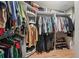 Spacious walk-in closet with built-in shelving and plenty of storage space at 8614 Hibiscus Dr, Tampa, FL 33637
